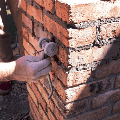 Marshalltown Chariot Brick Joint Mortar Raker - M89 Being used on a wall to rake mortar from the joints